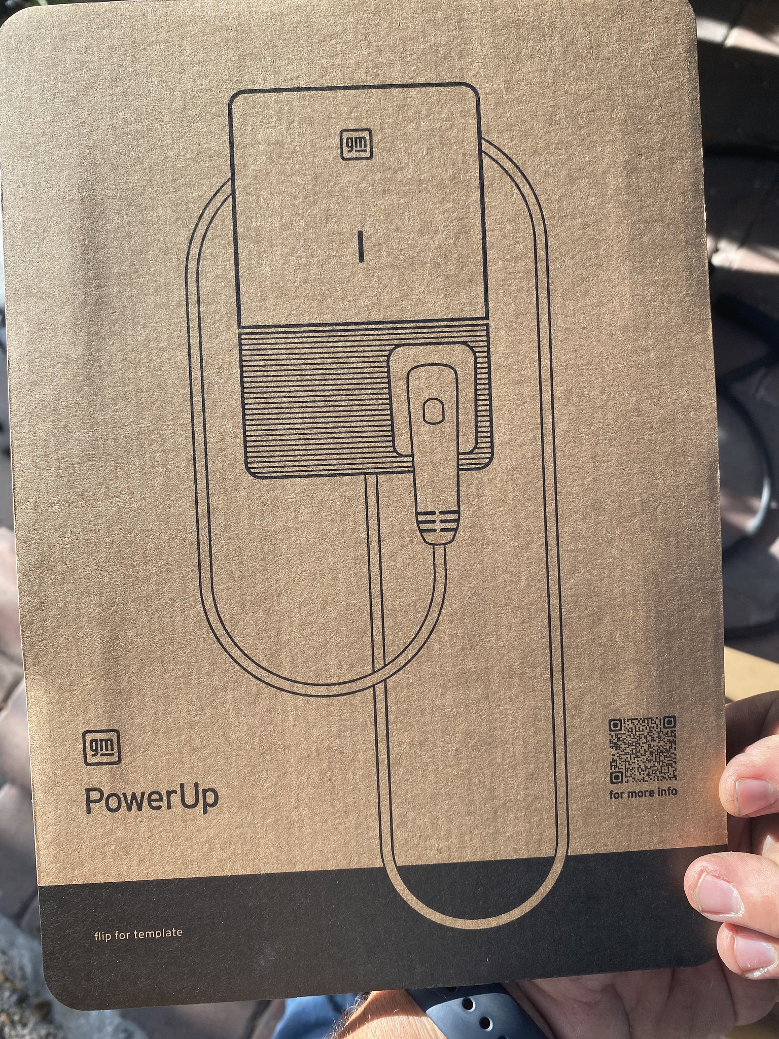 Second view of the wall-mounted GM Level 2 EV charger installation.