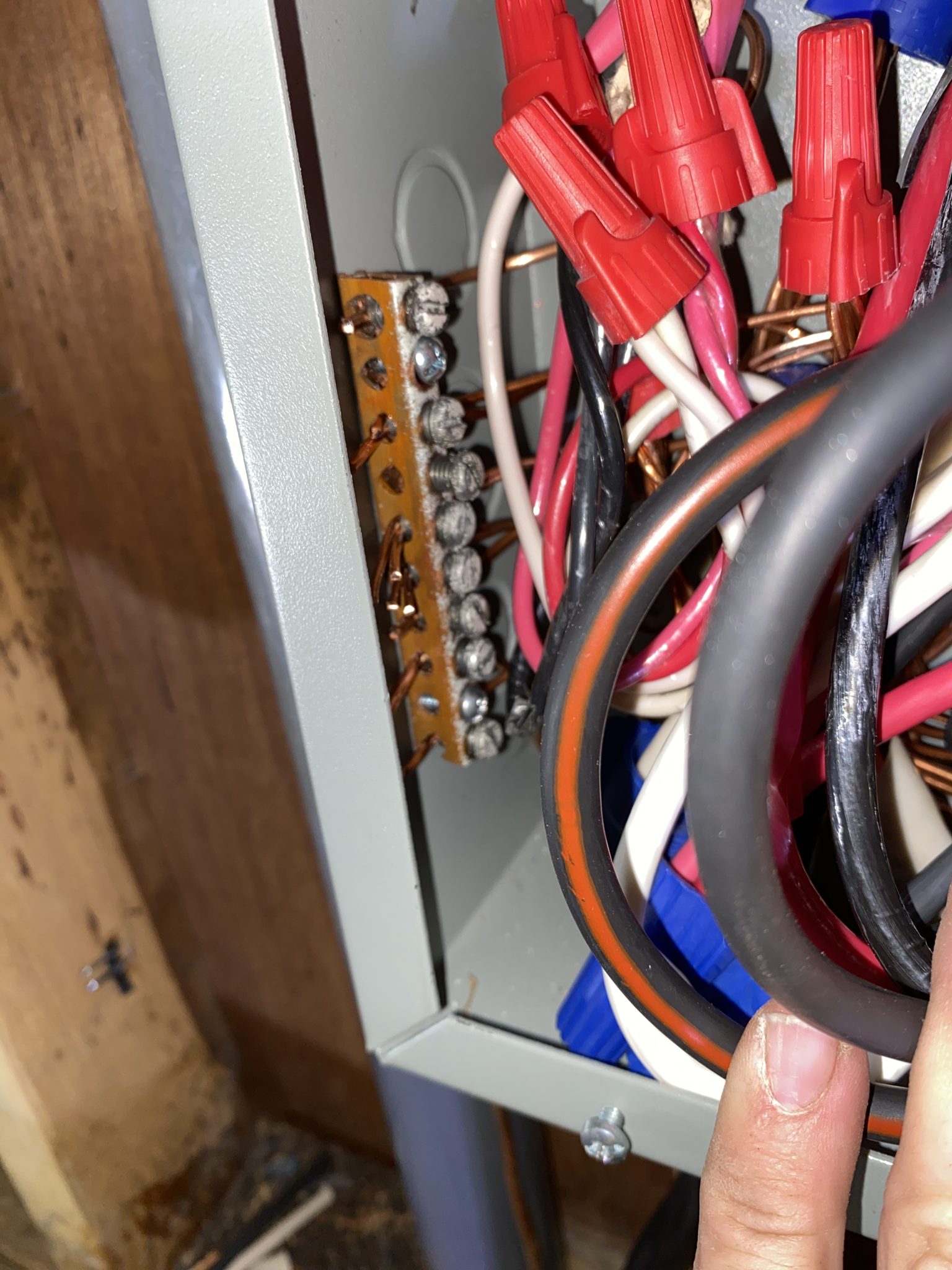 Wiring inside a home electrical panel during an upgrade.