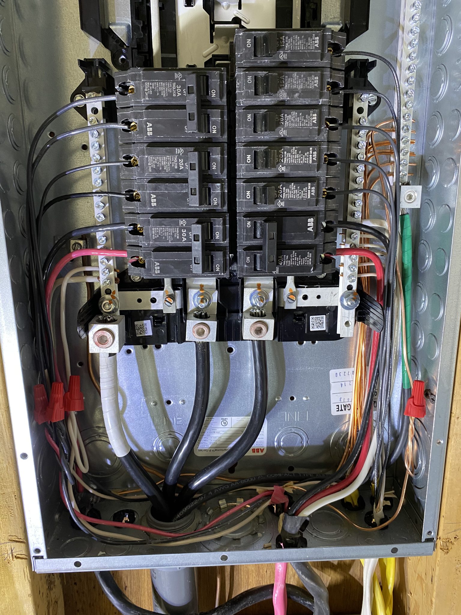 Second view of home electrical panel wiring during an upgrade.