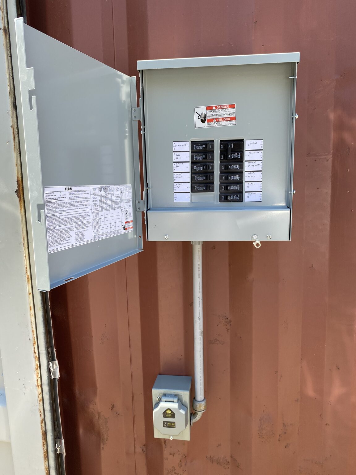 Second view of electrical panel service work from a March 2026 home visit.