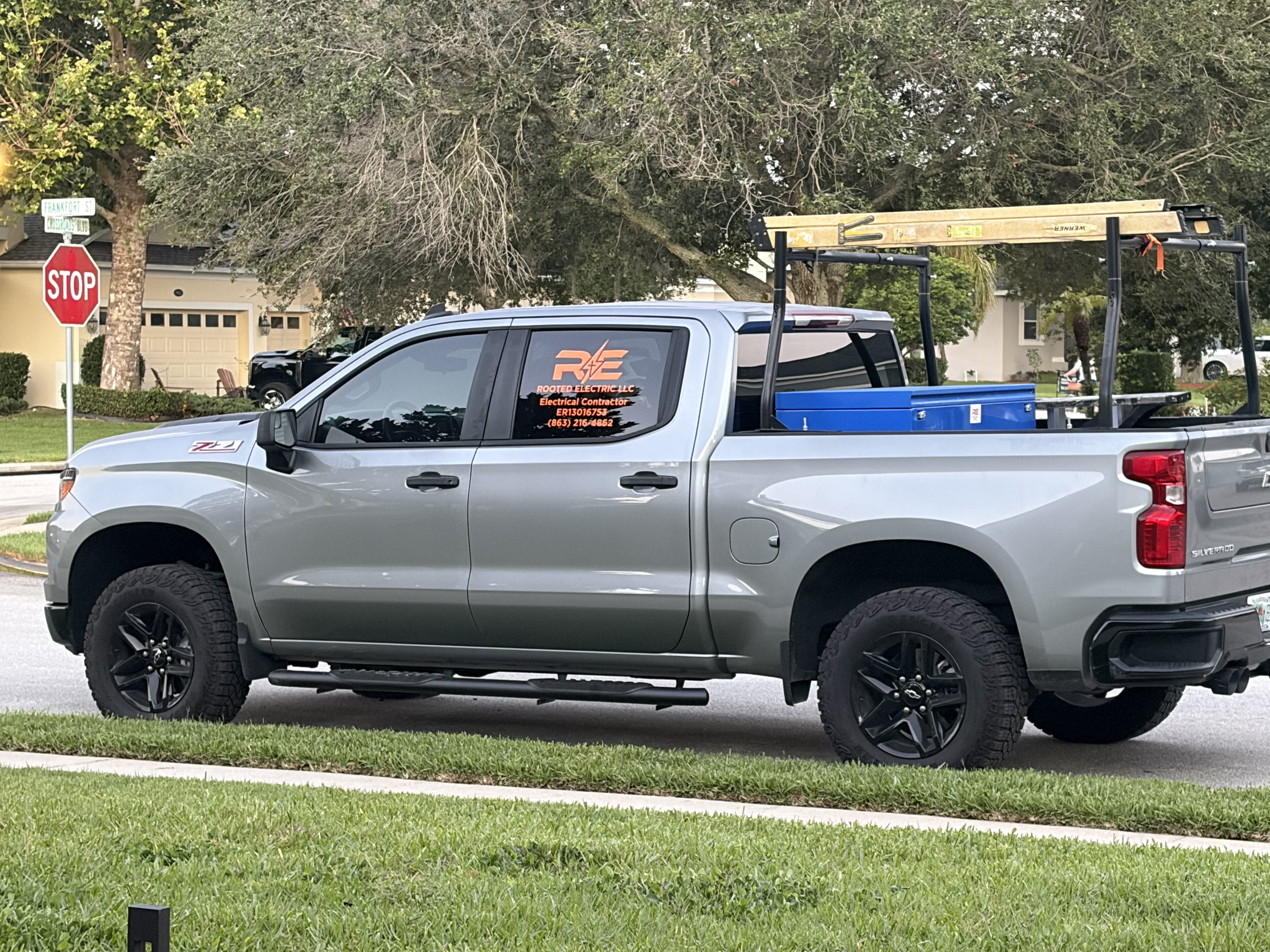 Rooted Electric work truck serving a neighborhood in Polk County