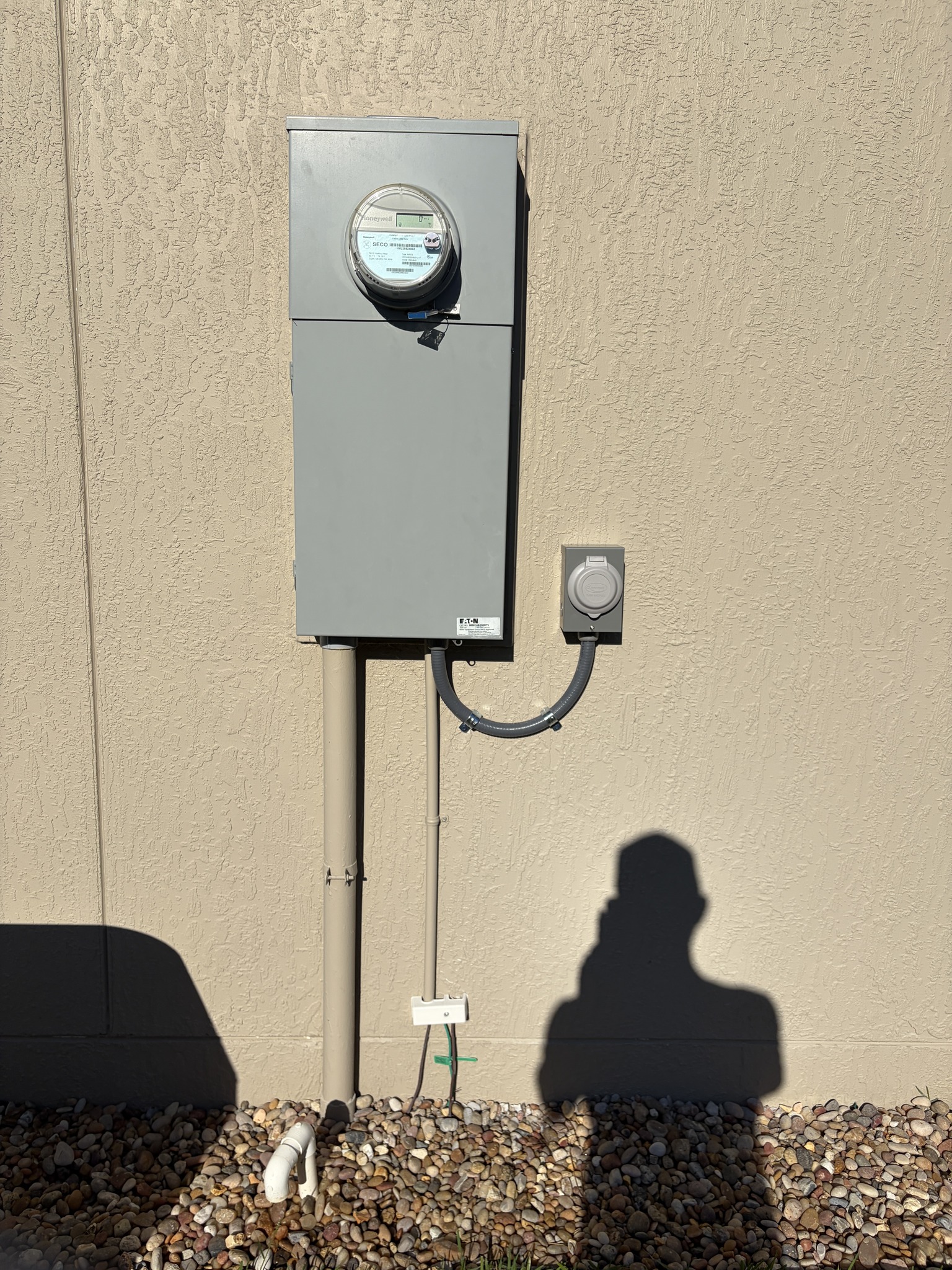 Generator interlock kit installed on a breaker panel, preventing generator and utility power from being connected at the same time.